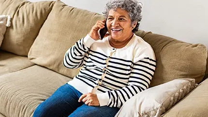 Senior woman talking to customer service on phone